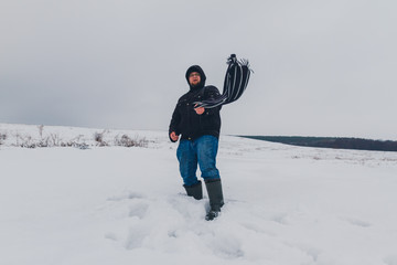 Fototapeta na wymiar traveler walking in a winter steppe