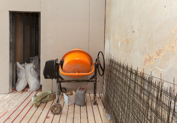 Electric concrete mixer in an apartment   during on the renovation and construction ( remodel)