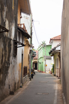 GALLE, SRI LANKA - JANUARY 29, 2016: cool view of the cozy street with houses and bicycles in exotic Sri Lanka