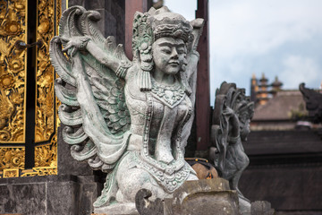 Stone sculpture on entrance door of the Temple in Bali
