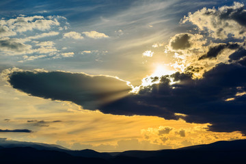 Fototapeta na wymiar Clouds floating across the sky at sunset