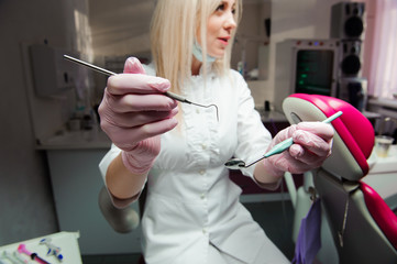 Close-up of dentist's hands and dental equipment. dentist inspection