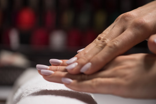 woman fingers with french manicure