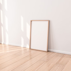Poster with Wooden Frame Mockup standing on the floor in empty room. 3d rendering