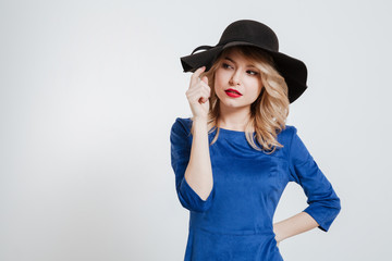 Amazing young woman wearing hat posing