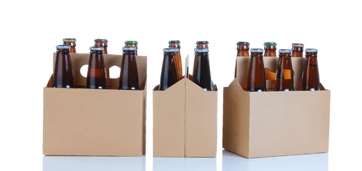 Foto auf Leinwand Six packs of glass bottled beer in generic brown cardboard carriers on white background © tab62