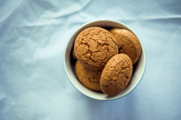 Oatmeal cookies in a blue bowl