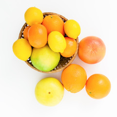 Fruit's background. Citrus fruits - lemon, orange, grapefruit, sweetie and pomelo on white background. Flat lay, top view.