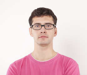 Fototapeta premium Young man in pink shirt and glasses