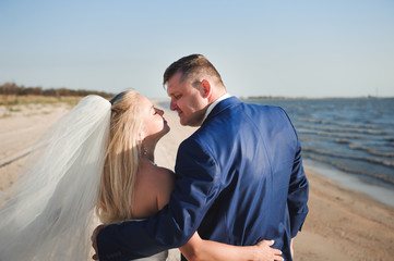 couple in love on the beach on their wedding day