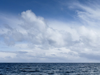Naklejka na ściany i meble Clouds above Ocean