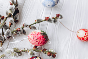 Easter concept branches twigs  and eggs on a wooden background