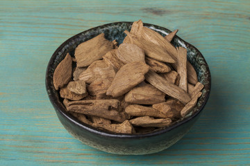 Agarwood, also called aloeswood incense chips isolated on white