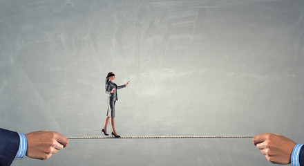 She is walking blindfolded . Mixed media