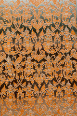 Detail at Thai art on metal of the Deity and Angel in the Wihan of Wat Pa Phu Kon,Thailand.