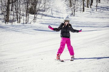 Fototapeta na wymiar Young skier learning to ski downhill