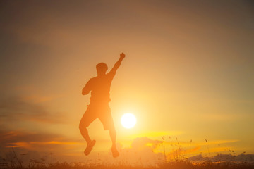 Man show hands silhouette sunset background 