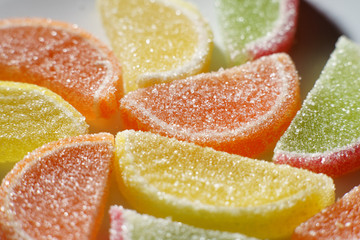 colored marmalade on white background closeup.