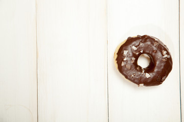 Doughnuts on a white wooden table