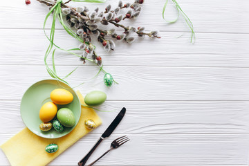 Easter concept. plate, fork, eggs on a white background