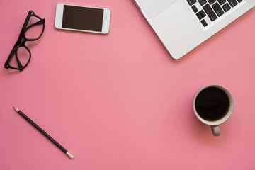 Flat Design of Workspace desk with Labtop, pencil, glasses, mobile phone and coffee cup on Vintage pastel color background.