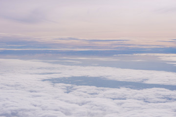 Blue sky and Clouds as seen through window of aircraft