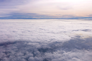 Naklejka na ściany i meble Blue sky and Clouds as seen through window of aircraft