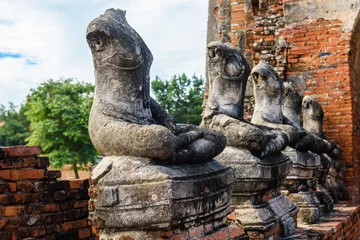 Fotobehang Majestic ruins of 1629 Wat Chai Watthanaram built by King Prasat Tong with its principal Prang (center) representing Mount Meru, the abode of the gods © nipastock