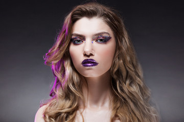 Fototapeta premium Young beautiful girl with creative make up. Attractive blonde, close-up