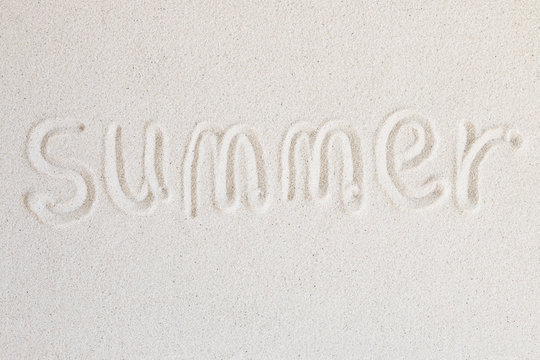 "Summer" words written on the beach