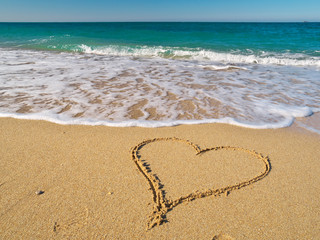 Heart on the sand of a beach.