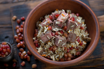 Close-up of a ceramic bowl with georgian style pilaf, selective focus