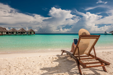 Young woman with tablet pc at the beach