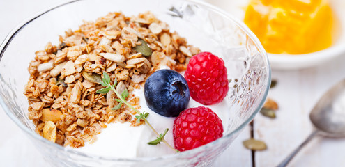 Healthy breakfast. Fresh granola, muesli in bowl.