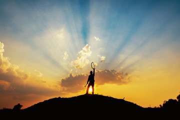 silhouette of craftsman standing on the hill ,Success victory happiness,labor day concept