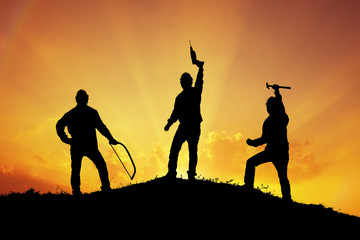 silhouette of Group of craftsman standing on the hill ,Success victory happiness,labor day concept