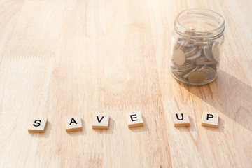 SAVE UP word on wood blocks concept