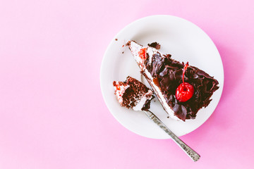 Chocolate cake on pink background