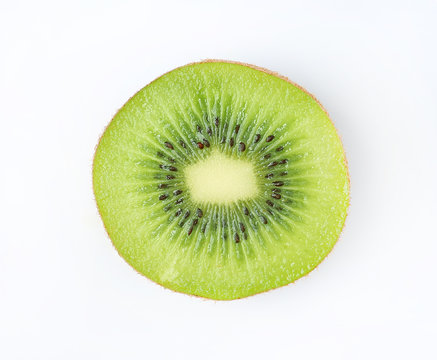 Slice of juicy kiwi fruit isolated on white background