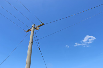 power pole and power lines in a blue sky