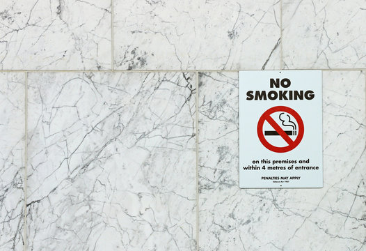 No Smoking sign on the wall of a public building
