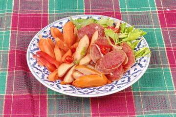 Spicy sour mixed vegetable salad with sausage and Chinese sausage.