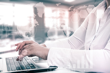 Business woman using a laptop to analysis marketing.