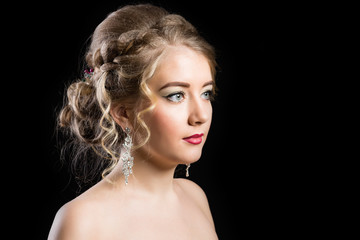 Fototapeta premium Fashionable make-up for a girl with beautiful hairdress