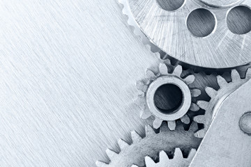 industrial gears on scratched background for technology concept closeup