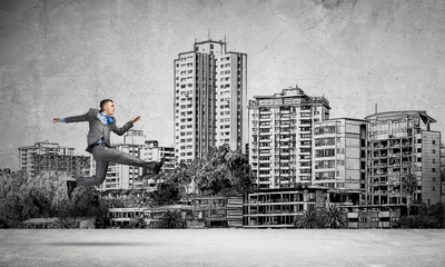 Businessman jumping high