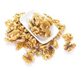 Close - up edible seeds walnut on white background