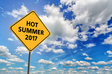 Blue cloudy sky and yellow sign