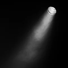 Zelfklevend Fotobehang Ray of scenic spot light over black smoke © evannovostro