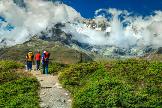 Family hiking in high mountains, Switzerland, Europe